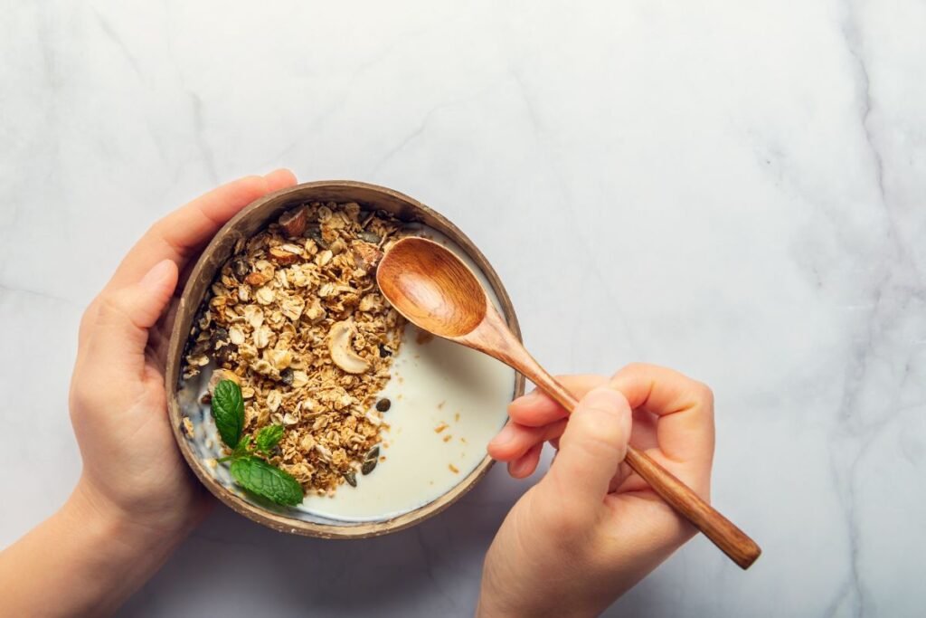 Roasted-healthy-homemade-granola-with-gluten-free-rolled-oats-variety-of-chopped-nuts-and-seeds-and-maple-syrup